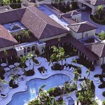 Bird’s eye view of a large property with several pools