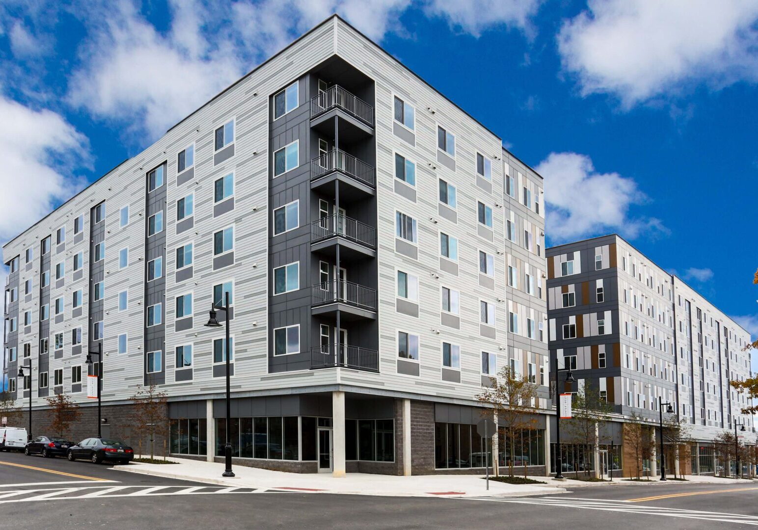 Modern apartment building with retail space.